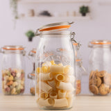 Clear KILNER Clip Round canning jar with metal clip lid for preserving food and storing ingredients.