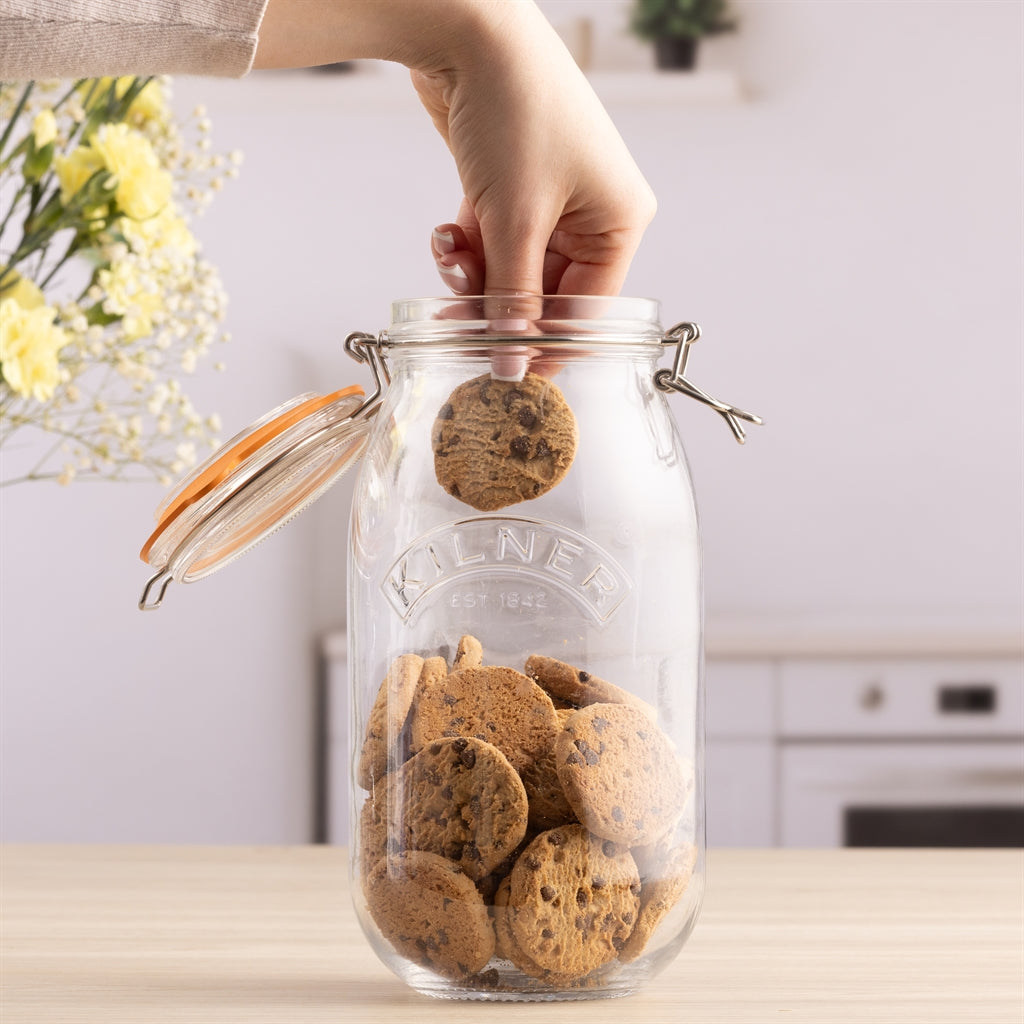 Clear KILNER clip round canning jar for preserving, with a glass lid and metal clip closure, ideal for food storage.