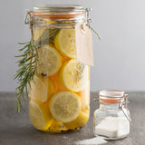 Clear Kilner Clip Round canning jar with metal clips and rubber seal for preserving food.