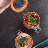 KILNER Clip Round clear glass jar for canning and storage, with metal clip lid and transparent appearance.
