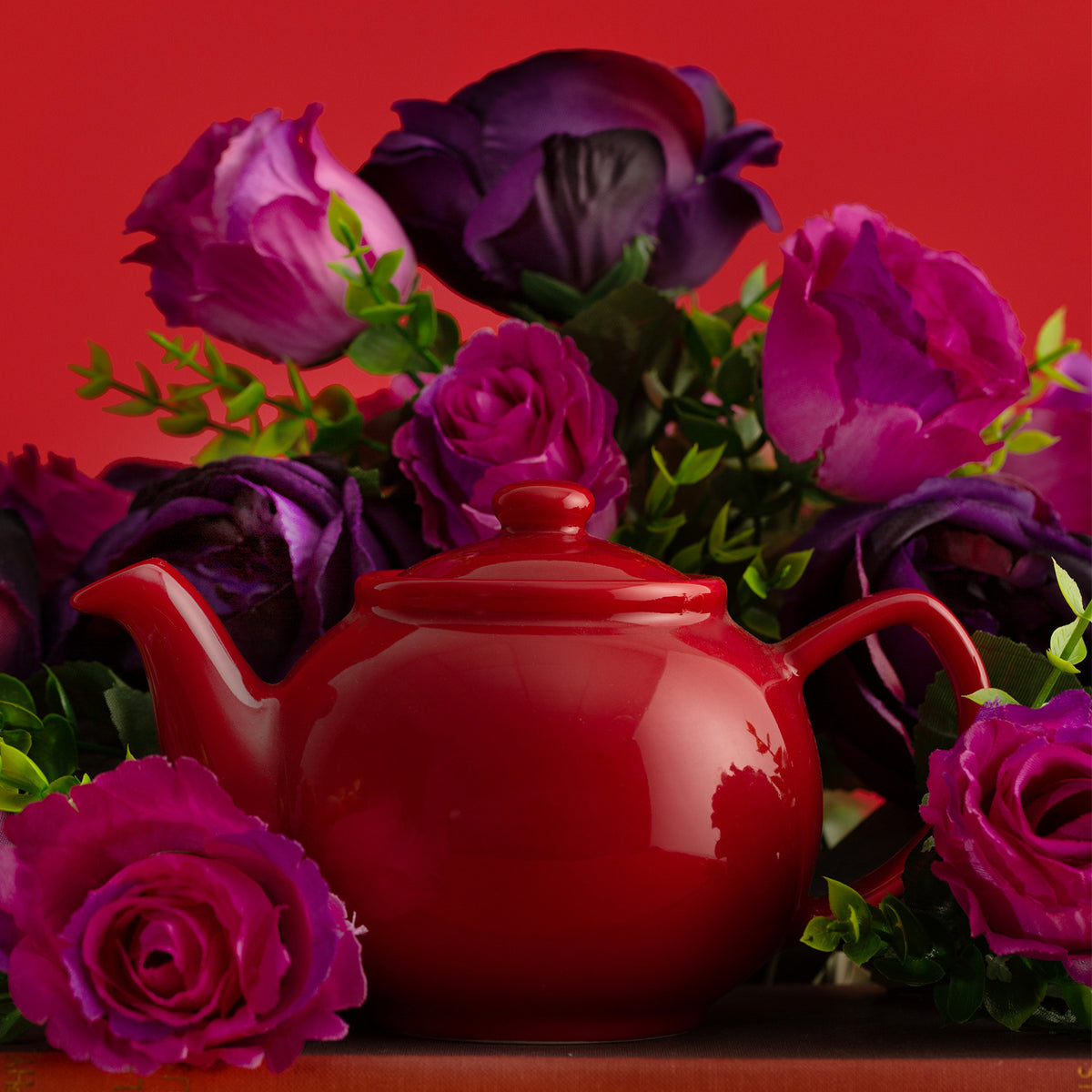 Red P & K Kensington teapot from Price & Kensington with 10 cups, ceramic tea kettle for brewing and serving tea.