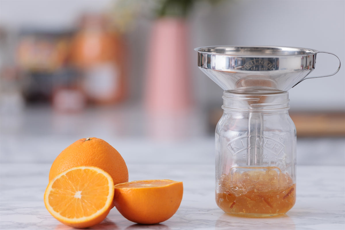 Stainless steel KILNER juice funnel, 13 cm, with wide opening for easy pouring and transferring liquids into bottles.