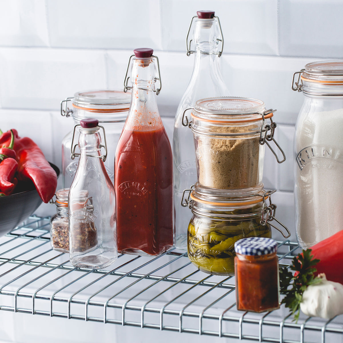 KILNER CLIP SQUARE glass canning jar in clear with metal clip lid, used for preserving and storing food.