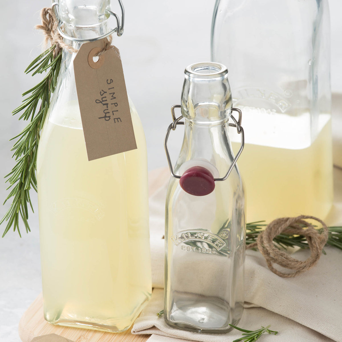 Clear KILNER Clip Square canning jar with metal lid for preserving fruits and vegetables, shown with a transparent glass body.