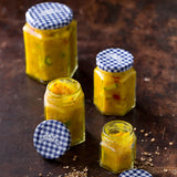 Clear KILNER 228 ml jar for canning with a metal lid, suitable for preserving fruits and vegetables in a home kitchen.