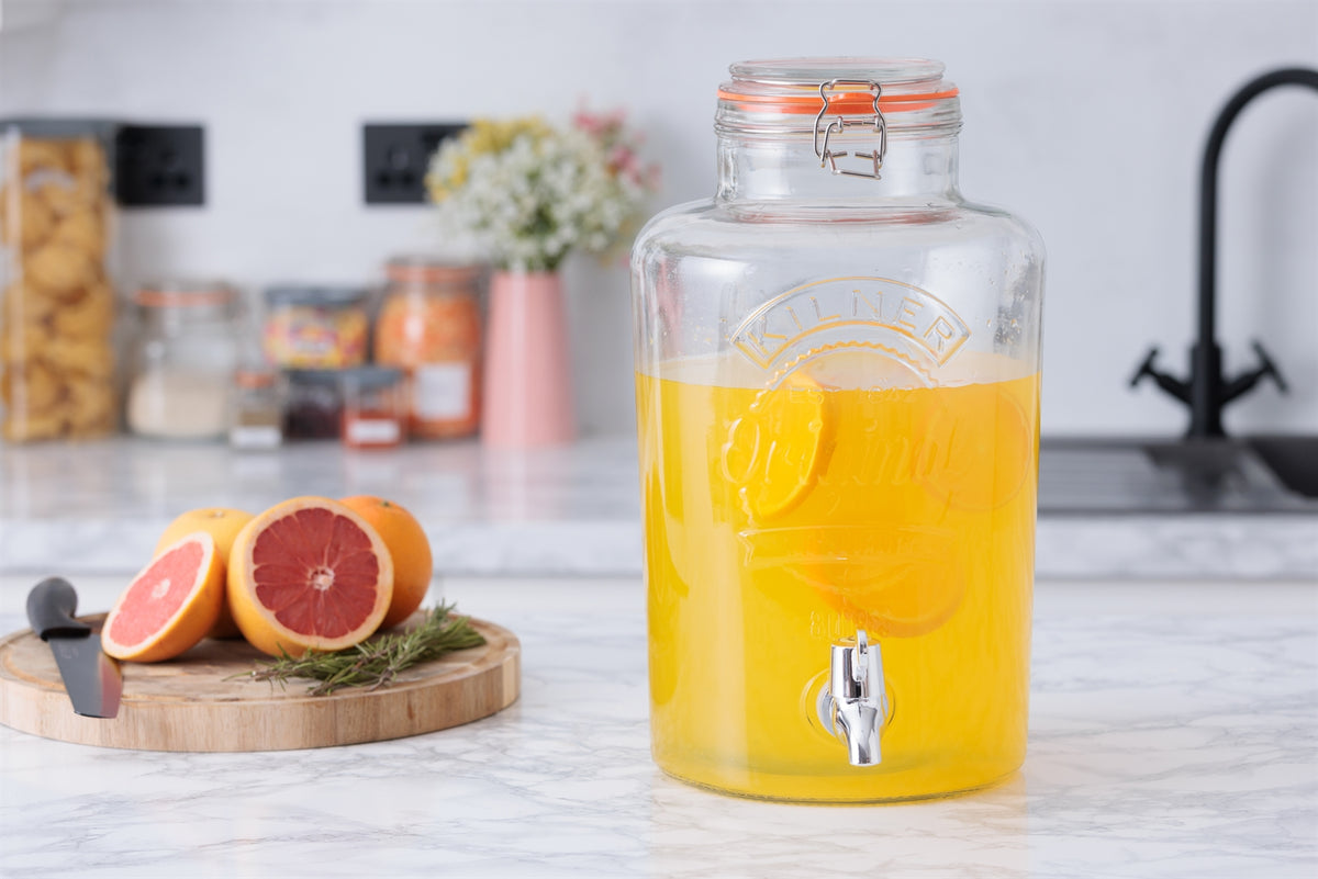Clear 8L KILNER drink dispenser with round shape, made of glass, suitable for serving beverages at gatherings.
