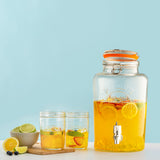 KILNER 5L clear round drink dispenser with spigot, made of transparent glass for serving beverages at parties and events.