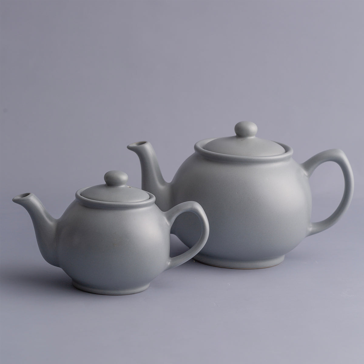 Gray teapot by Price & Kensington, P & K, with a classic design, shown in a detailed close-up image.