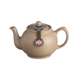P & K Teekanne in taupe with a sleek, modern design, perfect for serving tea in a stylish kitchen setting.