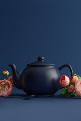 Blue P & K Kensington teapot with a smooth, rounded design and a curved handle, showcasing a stylish tea brewing vessel.