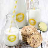 KILNER glass milk bottle with secure screw cap, clear transparent container for storing and pouring milk.