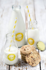 KILNER glass milk bottle with a clear, cylindrical design and metal screw cap, perfect for storing and serving fresh milk.