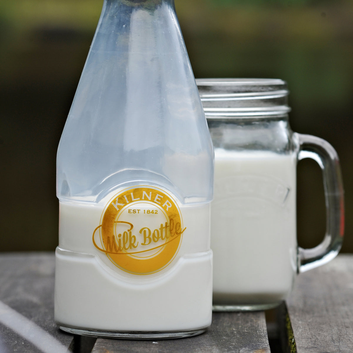 KILNER glass milk bottle with a clear cylindrical design and screw-top lid, featuring the product barcode 5010853217659.