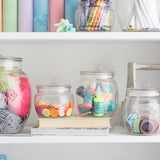 Kilner universal storage jar with transparent glass body and metal lid for preserving and organizing kitchen pantry items.