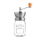 KILNER manual coffee grinder with crank handle and clear glass body, 500 ml capacity, showing the grinding mechanism inside.