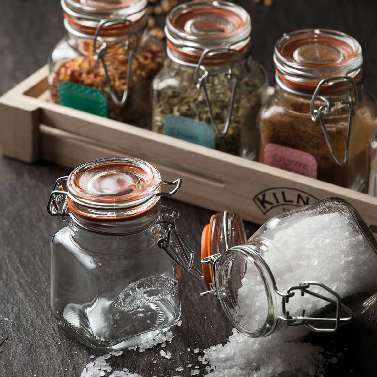 Set of six clear KILNER spice jars with metal lids, each holding 70ml, ideal for storing and organizing spices.