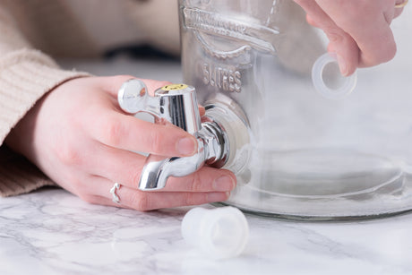 Gray KILNER drink dispenser tap, showing a close-up of the spout and handle for easy pouring.