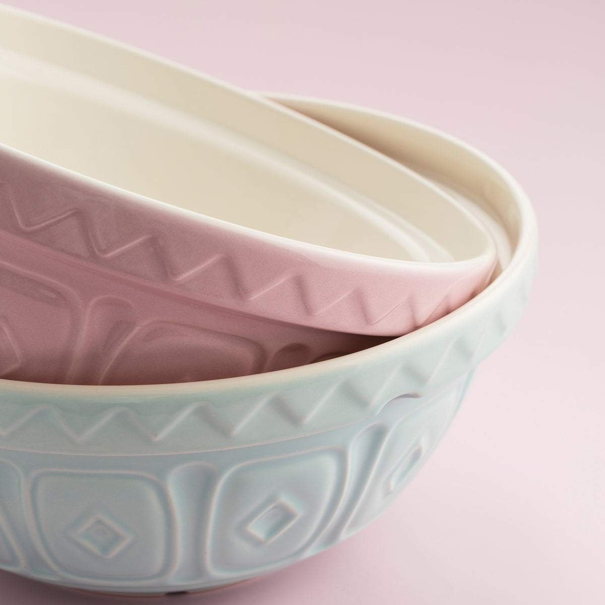 Pink Mason Cash mixing bowl with a smooth exterior and wide open top, ideal for baking and mixing ingredients.
