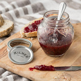 Clear KILNER marmalade jar with a metal screw lid, transparent glass showing interior, ideal for storing jams and preserves.