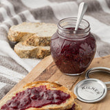 Transparent KILNER marmalade jar with a metal lid, showcasing a clear glass design for storing homemade jams and preserves.