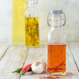 KILNER clear clip square canning jar with metal clamp lid for preserving fruits and vegetables.