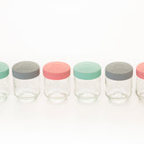 Colorful KILNER baby jars in clear glass with vibrant patterns, perfect for storing baby food or snacks.