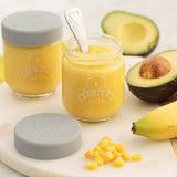 KILNER Babygläser set featuring clear and colorful glass jars for storing baby food or snacks, with vibrant lid designs.