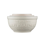 Mason Cash white 4-piece measuring cup set with clear markings, designed for precise kitchen measuring tasks.