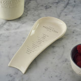 White Mason Cash spoon rest, 25 cm long, with a simple, functional design for holding cooking utensils.