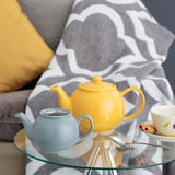 Yellow P & K Teekanne teapot with a glossy finish, showing the spout and lid from a side angle.
