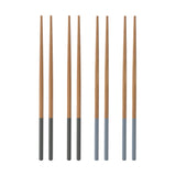 Set of four TYPHOON wooden Asian chopsticks, traditional bamboo utensils for Asian cuisine dining.