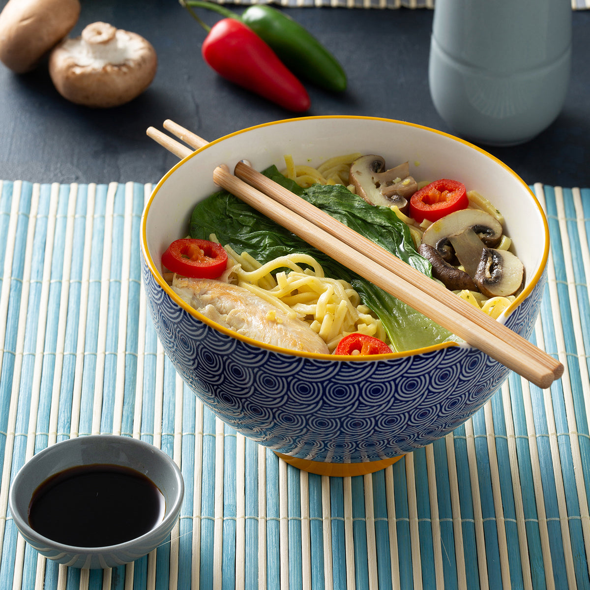 Blue TYPHOON noodle bowl with matching chopsticks, Asian style, round with diameter visible in the image.