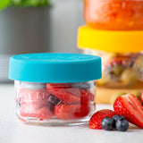 KILNER Babygläser set with colorful, clear glass jars for storing baby food or snacks, featuring playful designs and secure lids.