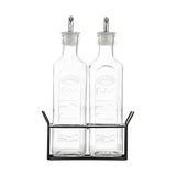 KILNER clear oil and vinegar bottles set with glass bottles and metal pour spouts for kitchen storage.