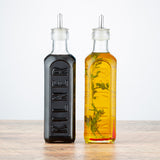 Clear KILNER oil and vinegar bottle with a glass body and metal screw cap for kitchen use.