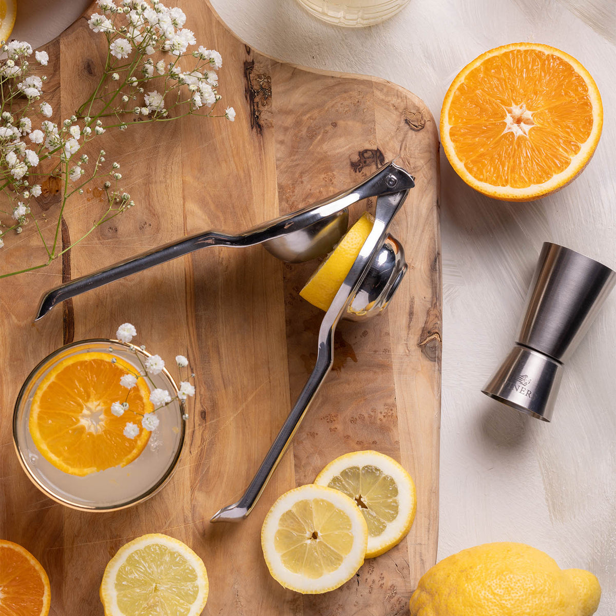 VINERS stainless steel lemon press with ergonomic handle and textured surface for easy juicing.