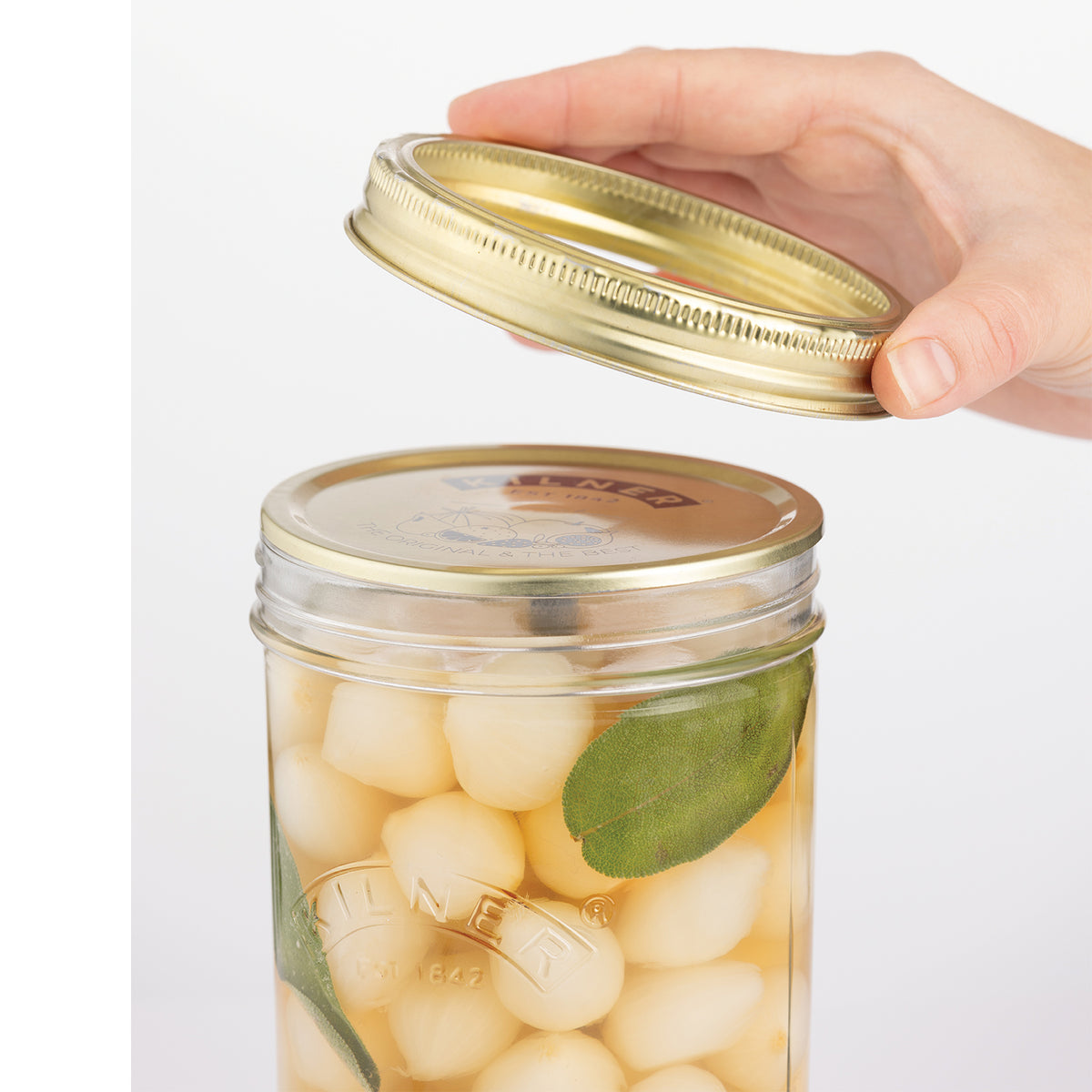 Clear Kilner wide-mouth jam jar with metal screw lid for preserving and storing food in a durable glass container.