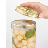 Clear Kilner wide-mouth jam jar with metal screw lid for preserving and storing food in a durable glass container.