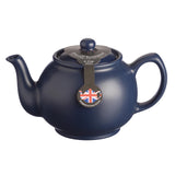 Blue P & K teapot with built-in tea infuser and six matching cups, perfect for brewing and serving tea.