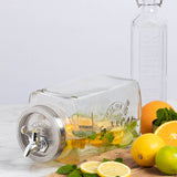 KILNER 3L clear and silver beverage dispenser for fridge, with a spout for easy pouring and a secure lid.