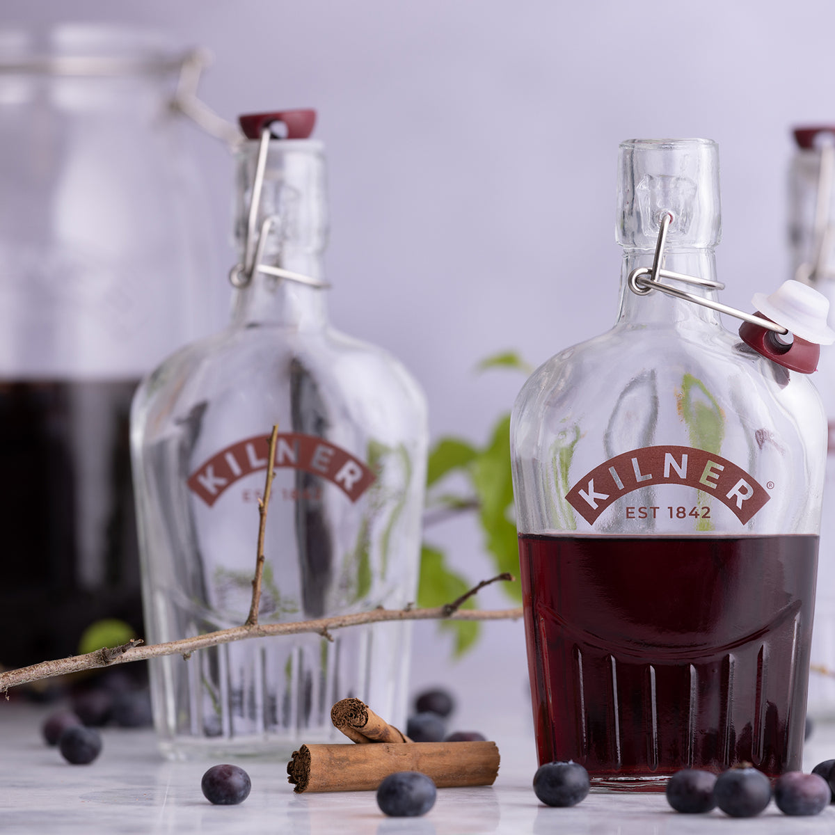 Clear 300ml Kilner gin bottle with a square glass design and screw cap, perfect for storing or gifting homemade gin.