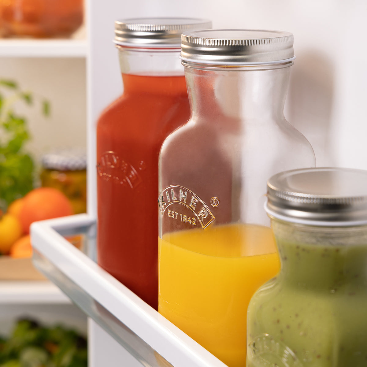 Kilner glass juice bottle with a clear, cylindrical design and screw-top lid for storing fresh fruit juice.