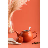 Price & Kensington Teekanne teapot with orange design, showcasing the ceramic kettle with vibrant orange patterns and a handle.