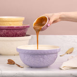 Transparent Mason Cash mixing bowl with floral meadow design, ideal for baking and kitchen prep.