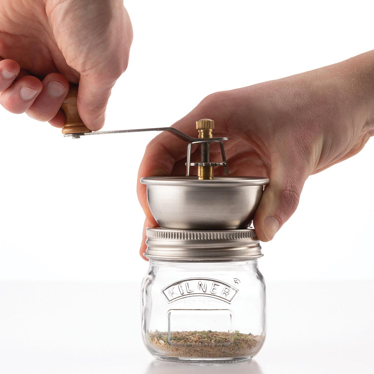 KILNER spice grinder with clear glass body and black top, 250 ml capacity, used for grinding spices and herbs.
