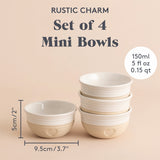Set of four beige Mason Cash rustic charm bowls with a classic, textured design, perfect for serving or mixing in the kitchen.