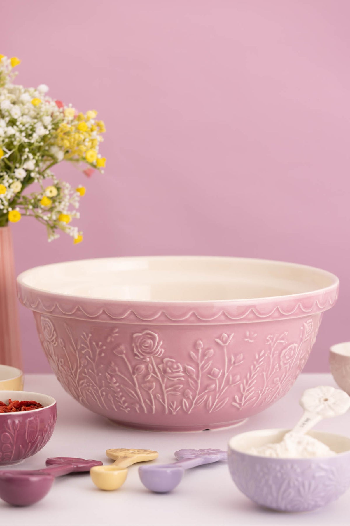 Transparent Mason Cash mixing bowl with "In the Meadow" design, featuring a clear, durable ceramic construction.