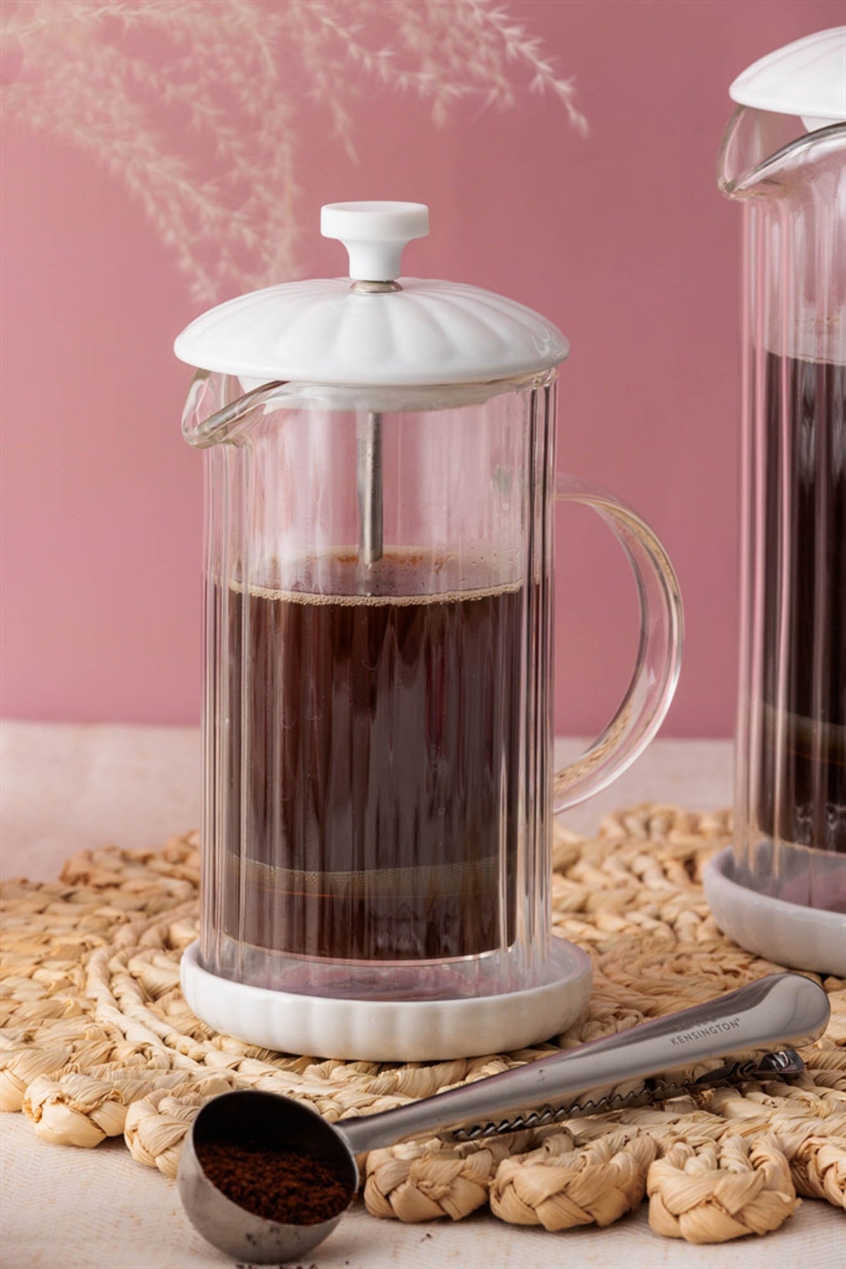 P & K Luxe white French press coffee maker with a glass carafe and stainless steel lid, stylish and modern kitchen accessory.