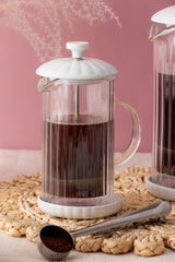 P & K Luxe white French press coffee maker with a glass carafe and stainless steel lid, stylish and modern kitchen accessory.