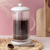 P & K French press Luxe in white with glass carafe and stainless steel frame for brewing coffee or tea.